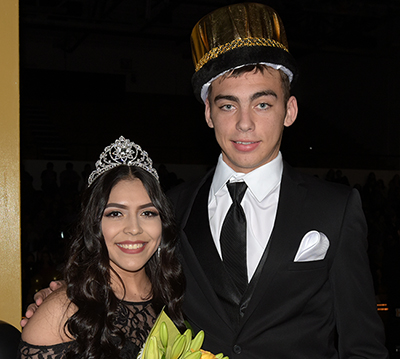 guy and girl in crowns and formal wear