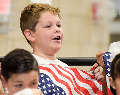 smiling boy with flag