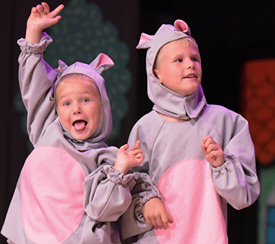two kids in rat costumes looking cute