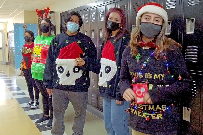 students in sweaters in hall
