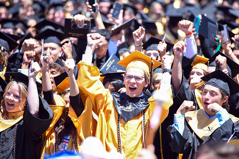 students celebrate graduating
