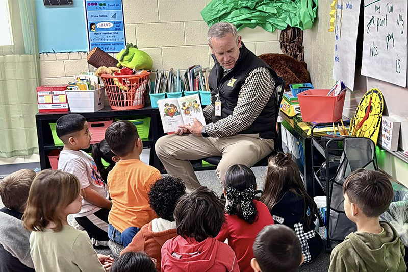 man reading to children