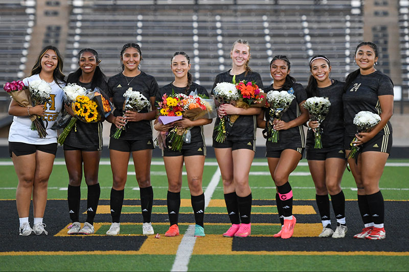 players posing for senior night