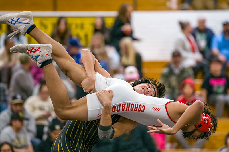 boy wrestler holding another in the air